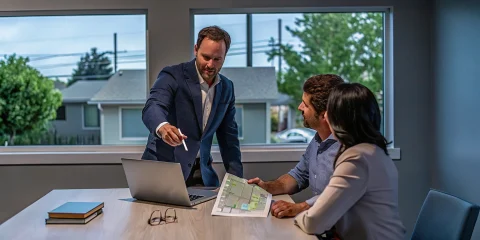 A couple discusses home loan options with a local mortgage broker they found.