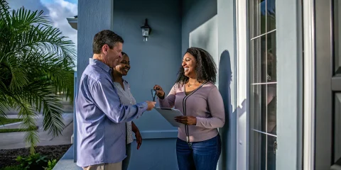 Florida homebuyers discussing a conventional 1 percent down option