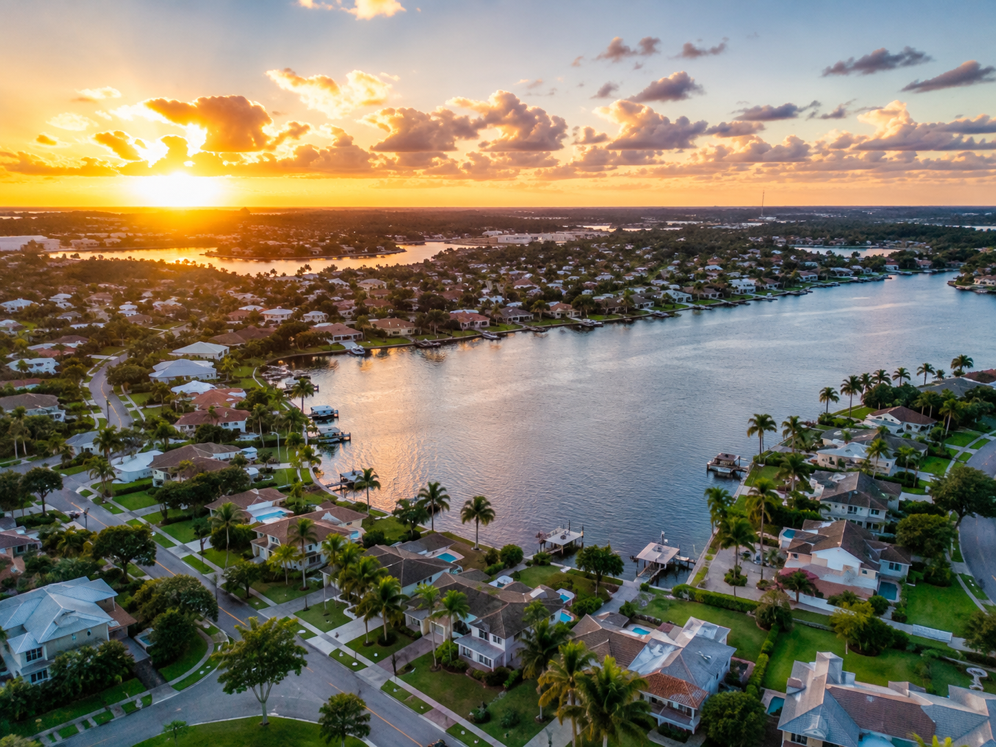 Aerial view of waterfront homes and canals in Lake Clarke Shores Florida